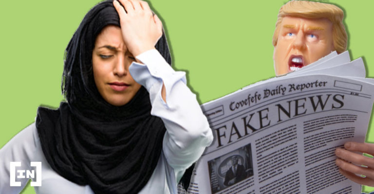 Frau hält sich den Kopf